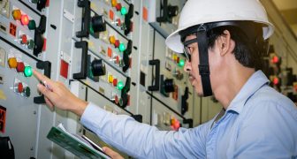 85344739 - industrial technician check voltage or current status in control panel of power plant.