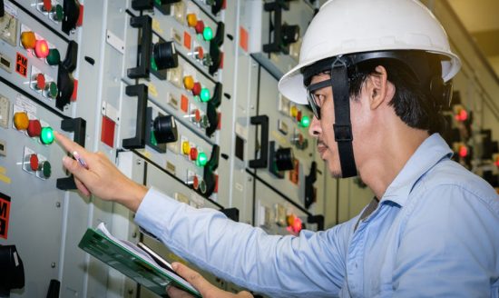 85344739 - industrial technician check voltage or current status in control panel of power plant.